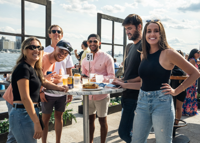 Friends hanging out at OktoberFest NYC 2021 at Watermark