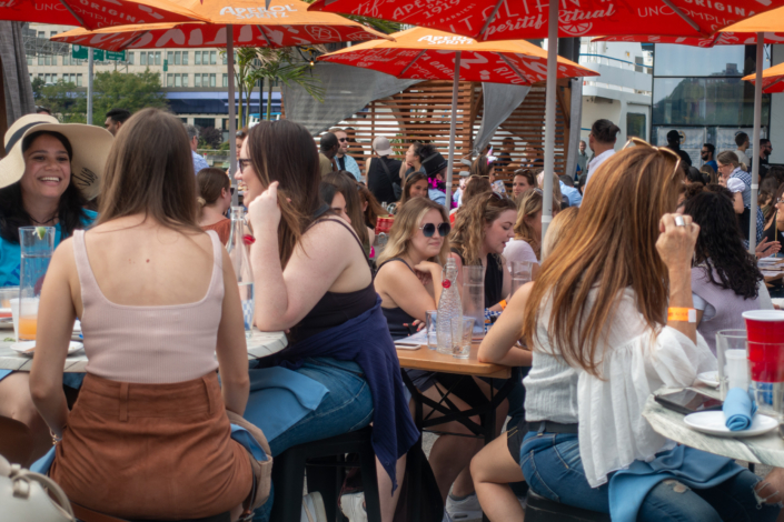 People hanging out at OktoberFest NYC 2021 at Watermark