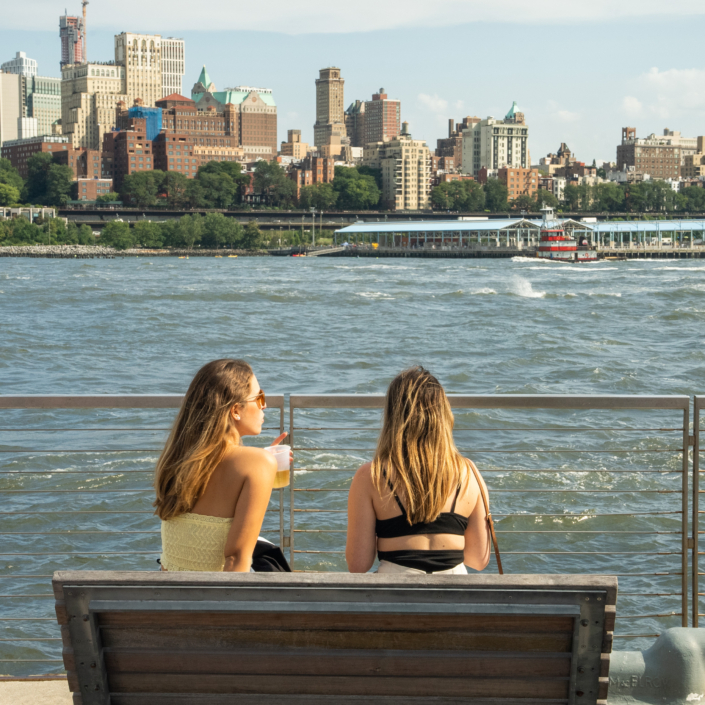 Girls enjoying the view by the water at OktoberFest NYC 2021 at Watermark