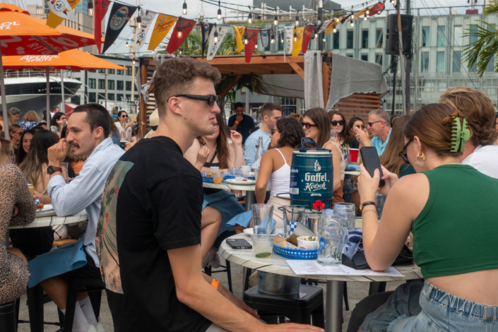 People hanging out at OktoberFest NYC 2021 at Watermark