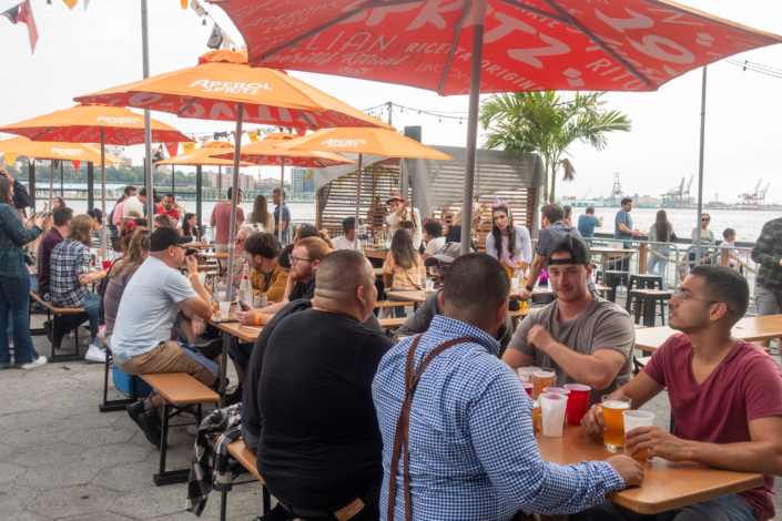 People hanging out at OktoberFest NYC 2021 at Watermark