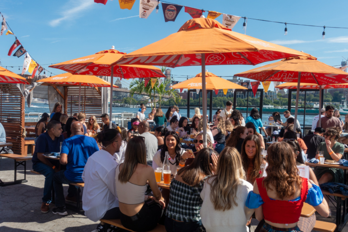 People hanging out at OktoberFest NYC 2021 at Watermark