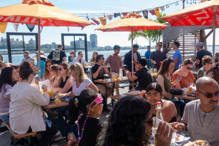 People hanging out at OktoberFest NYC 2021 at Watermark