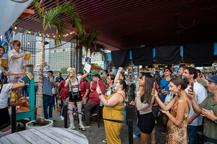 People having fun at OktoberFest NYC 2023 at Watermark - Beer Festival