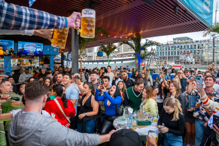 People having fun at OktoberFest NYC 2023 at Watermark - Beer Festival