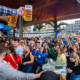 People having fun at OktoberFest NYC 2023 at Watermark - Beer Festival