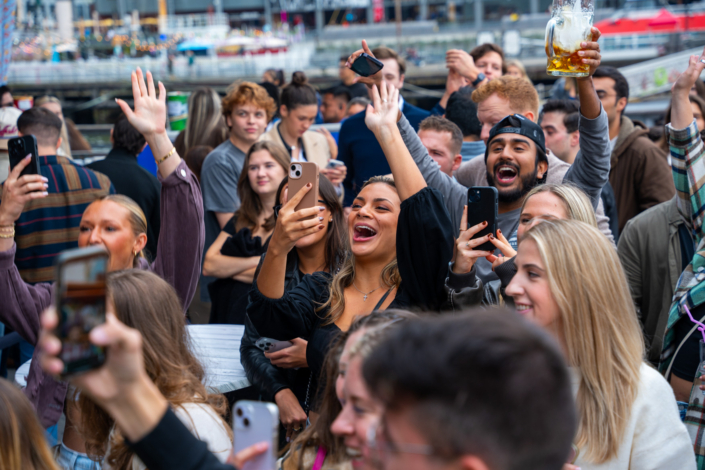 People having fun at OktoberFest NYC 2023 at Watermark - Beer Festival