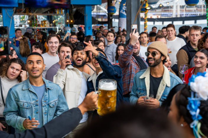 People having fun at OktoberFest NYC 2023 at Watermark - Beer Festival