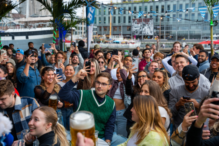 People having fun at OktoberFest NYC 2023 at Watermark - Beer Festival