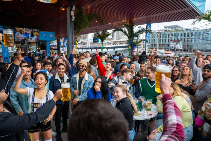 People having fun at OktoberFest NYC 2023 at Watermark - Beer Festival