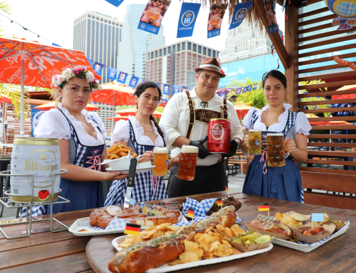 Team showcasing food & beer at OktoberFest NYC 2022 at Watermark