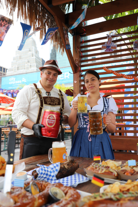 Models showcasing food & beer at OktoberFest NYC 2022 at Watermark