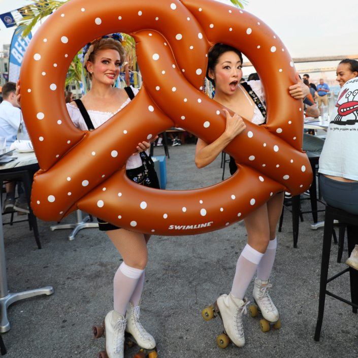 Models in German Lederhosen With Jumbo Pretzel at OktoberFest NYC 2023