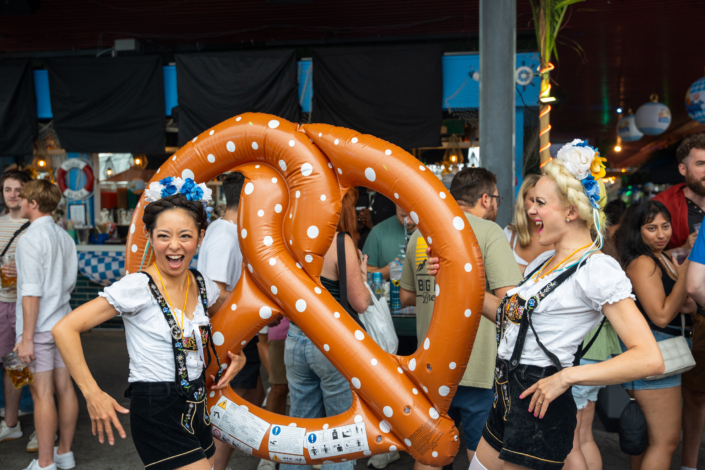 Models in German Lederhosen With Jumbo Pretzel at OktoberFest NYC 2023