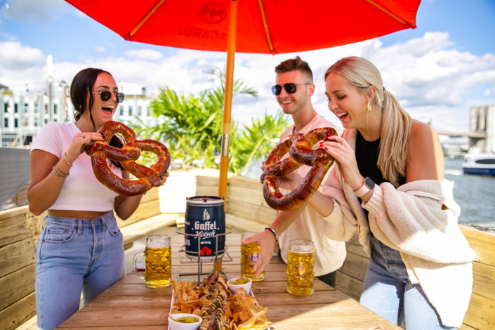 Friends enjoying food at OktoberFest NYC 2021