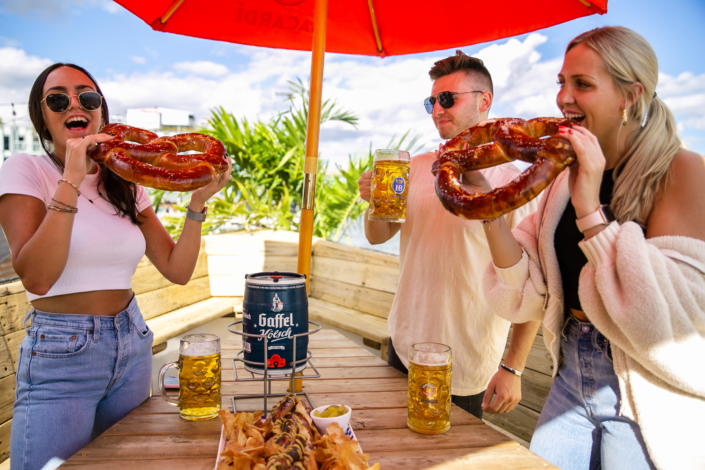 Friends enjoying food at OktoberFest NYC 2021